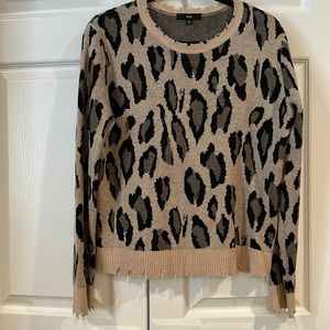 Leopard pattern sweater with distressed neck, sleeves, and hemline.  By Fate
